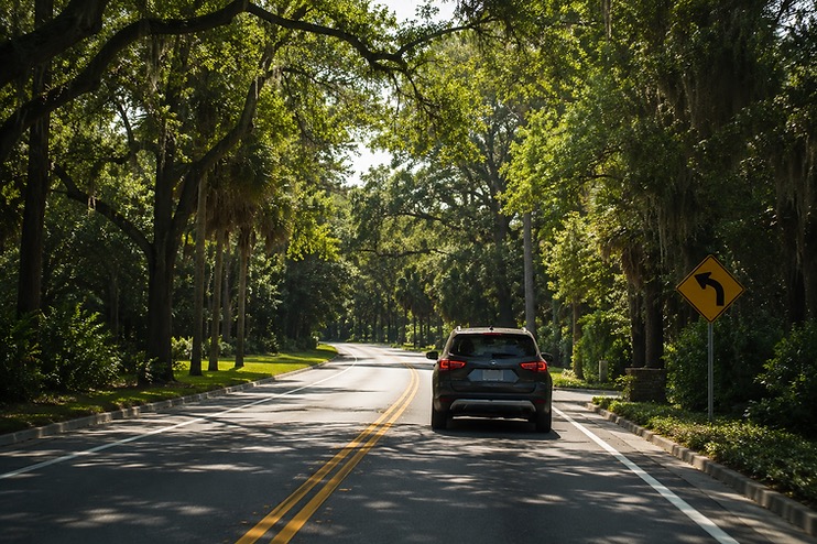 A car traveling along a quiet road